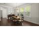 Bright dining room showcasing a chandelier, dining table, and decorative accent wall at 3191 Moonlight Dr, Charleston, SC 29414