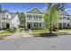 Charming two-story home with a double porch, tidy lawn, and landscaped yard at 3191 Moonlight Dr, Charleston, SC 29414