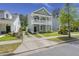 Charming two-story home with a double porch, tidy lawn, and landscaped yard at 3191 Moonlight Dr, Charleston, SC 29414
