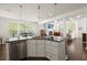 Open-concept kitchen with a large island and views into the adjacent dining and living areas at 3191 Moonlight Dr, Charleston, SC 29414