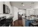 Bright kitchen with stainless steel appliances, granite countertops, and custom white cabinets at 3191 Moonlight Dr, Charleston, SC 29414
