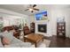 Comfortable living room featuring a fireplace, built-in shelving, and hardwood floors at 3191 Moonlight Dr, Charleston, SC 29414