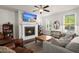 Living room features a fireplace, windows with bright light, and an accent mirror at 3191 Moonlight Dr, Charleston, SC 29414