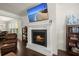 Inviting living room featuring a cozy fireplace with a mounted television above at 3191 Moonlight Dr, Charleston, SC 29414