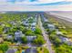 Aerial view of the community featuring lush tree coverage and beach in the distance at 3301 Palm Blvd, Isle of Palms, SC 29451