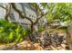 Backyard fire pit area with chairs and landscaping at 3301 Palm Blvd, Isle of Palms, SC 29451