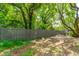View of the backyard featuring a modern wood fence with green foliage beyond at 3301 Palm Blvd, Isle of Palms, SC 29451