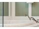 Close up of bathtub featuring bronze faucet hardware at 3301 Palm Blvd, Isle of Palms, SC 29451