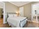 Bedroom features neutral colors, beautiful floors, and an adjoining bathroom at 3301 Palm Blvd, Isle of Palms, SC 29451
