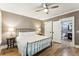 Bedroom with wrought iron bed frame and ensuite bath at 3301 Palm Blvd, Isle of Palms, SC 29451