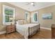 Cozy bedroom featuring natural light, hardwood floors, and a ceiling fan at 3301 Palm Blvd, Isle of Palms, SC 29451