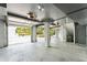 View of the spacious and well lit two-car garage with automatic doors and concrete floor at 3301 Palm Blvd, Isle of Palms, SC 29451