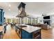 Open kitchen featuring a large center island with stainless steel appliances and eat-in seating at 3301 Palm Blvd, Isle of Palms, SC 29451