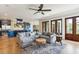 Open-concept living room and kitchen boasts stainless steel appliances and ample seating at 3301 Palm Blvd, Isle of Palms, SC 29451
