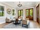 Bright living room featuring comfortable seating, a round coffee table, and natural light at 3301 Palm Blvd, Isle of Palms, SC 29451