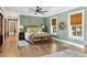 Beautiful main bedroom with a large bed, windows, and an ensuite bathroom at 3301 Palm Blvd, Isle of Palms, SC 29451