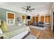 Spacious main bedroom with a seating area and plenty of natural light from the many windows at 3301 Palm Blvd, Isle of Palms, SC 29451