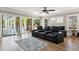 Comfortable media room with tiered seating and access to the outdoor patio and pool at 3301 Palm Blvd, Isle of Palms, SC 29451