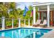 Inviting swimming pool featuring poolside lounge chairs and lush landscaping at 3301 Palm Blvd, Isle of Palms, SC 29451