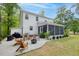 Well manicured backyard with fire pit and screened in porch at 3361 Olivia Marie Ln, Johns Island, SC 29455