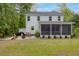Backyard features a screened in porch, grill, and seating around a fire pit at 3361 Olivia Marie Ln, Johns Island, SC 29455