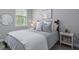 Bright bedroom with a well made bed and side table at 3361 Olivia Marie Ln, Johns Island, SC 29455
