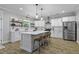 Spacious kitchen with white cabinetry, stainless steel appliances, center island, and modern pendant lighting at 3361 Olivia Marie Ln, Johns Island, SC 29455