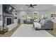 Spacious living room with a cozy fireplace, built-in shelves, and gray sectional sofa, perfect for relaxing at 3361 Olivia Marie Ln, Johns Island, SC 29455
