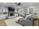 Inviting living room boasts a cozy fireplace, built-in shelves, and a comfortable gray sectional sofa at 3361 Olivia Marie Ln, Johns Island, SC 29455