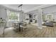 Open-concept living space with dining room and living room with fireplace and built-ins at 3361 Olivia Marie Ln, Johns Island, SC 29455
