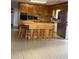Eat-in kitchen featuring wood cabinetry and updated appliances at 3807 Scott Creek Dr, Edisto Island, SC 29438