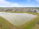 Aerial view of a large neighborhood with a pond at 401 Carrara Dr, Summerville, SC 29486