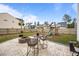 Spacious backyard with a patio, seating area, fire pit, and playset at 401 Carrara Dr, Summerville, SC 29486