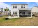 Backyard featuring a screened in porch, outdoor seating, and a stone fire pit at 401 Carrara Dr, Summerville, SC 29486