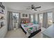 Comfortable bedroom featuring comic book themed bedding, ceiling fan and lots of natural light at 401 Carrara Dr, Summerville, SC 29486