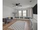 Cozy bonus room with built-in storage, a ceiling fan, and a comfortable seating area with neutral colors at 401 Carrara Dr, Summerville, SC 29486