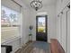 Bright entryway featuring a statement light fixture, decorative rug, and large window that brings in ample light at 401 Carrara Dr, Summerville, SC 29486