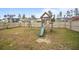 Fenced backyard featuring a wooden swing set and slide for Gathering fun at 401 Carrara Dr, Summerville, SC 29486
