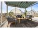Comfortable screened porch with stylish outdoor furniture and a view of the backyard at 401 Carrara Dr, Summerville, SC 29486