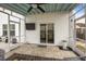 Screened in porch with a TV and sliding glass door to the home's interior at 401 Carrara Dr, Summerville, SC 29486