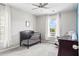 Neutral Bedroom room with crib, rocking chair, side tables, ceiling fan and lots of natural light at 4024 Exploration Rd, Ladson, SC 29456