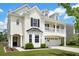 Inviting two-story home with a two-car garage, charming second-story balcony, and well-maintained front lawn at 4024 Exploration Rd, Ladson, SC 29456