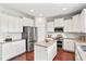 Well-lit kitchen with granite countertops, stainless steel appliances, and white cabinetry at 4024 Exploration Rd, Ladson, SC 29456