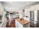 Open kitchen with granite countertops, stainless steel appliances, and access to the living room at 4024 Exploration Rd, Ladson, SC 29456