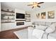 Cozy living room featuring a fireplace, built-in shelves, and comfortable sectional sofa at 4024 Exploration Rd, Ladson, SC 29456