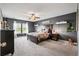 Spacious bedroom featuring a ceiling fan, large window, and stylish decor at 4024 Exploration Rd, Ladson, SC 29456