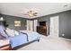 Main bedroom with gray walls, ceiling fan, and a spacious layout including a dresser with TV at 4024 Exploration Rd, Ladson, SC 29456