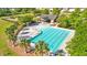 An aerial view of a swimming pool and lounge area with nearby playground offering community recreation at 4024 Exploration Rd, Ladson, SC 29456
