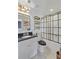 Modern bathroom with a black and white theme, featuring a glass-enclosed shower at 404 Forsythia Ave, Summerville, SC 29483