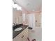 Bathroom features a white shower curtain, black hardware, and stylish black and white tile at 404 Forsythia Ave, Summerville, SC 29483